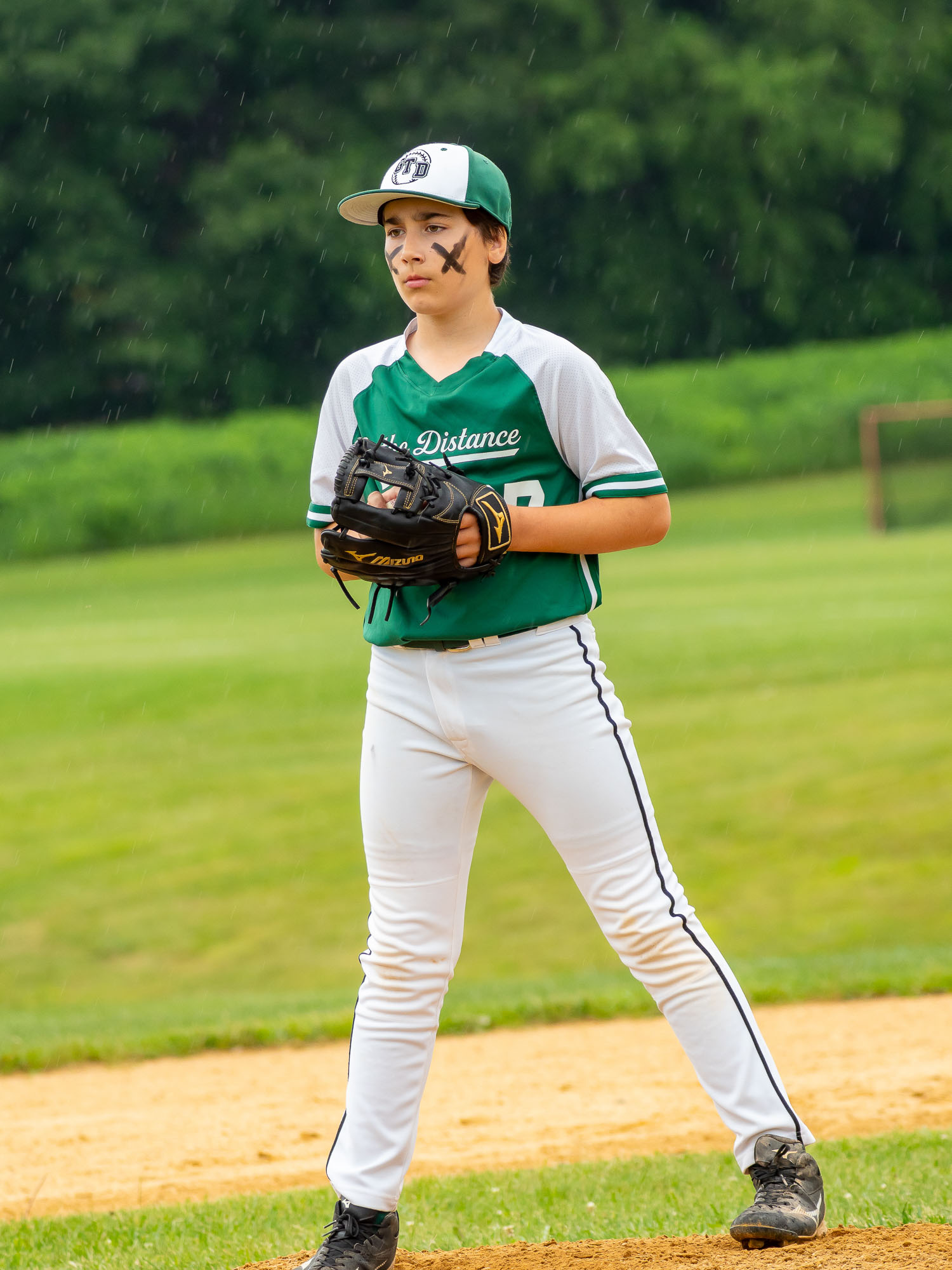 Pitcher with eye black in the rain