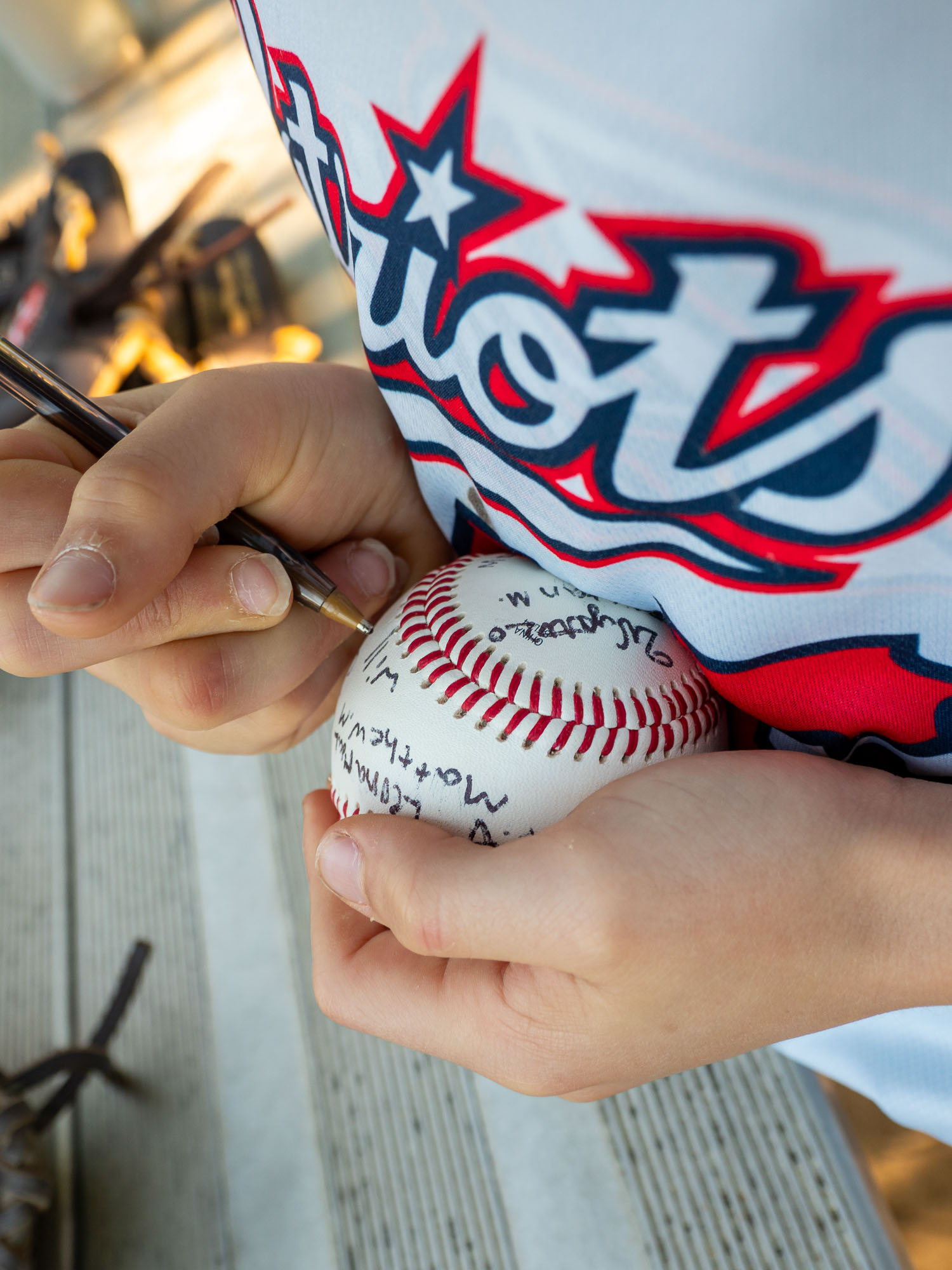Players signing the game ball