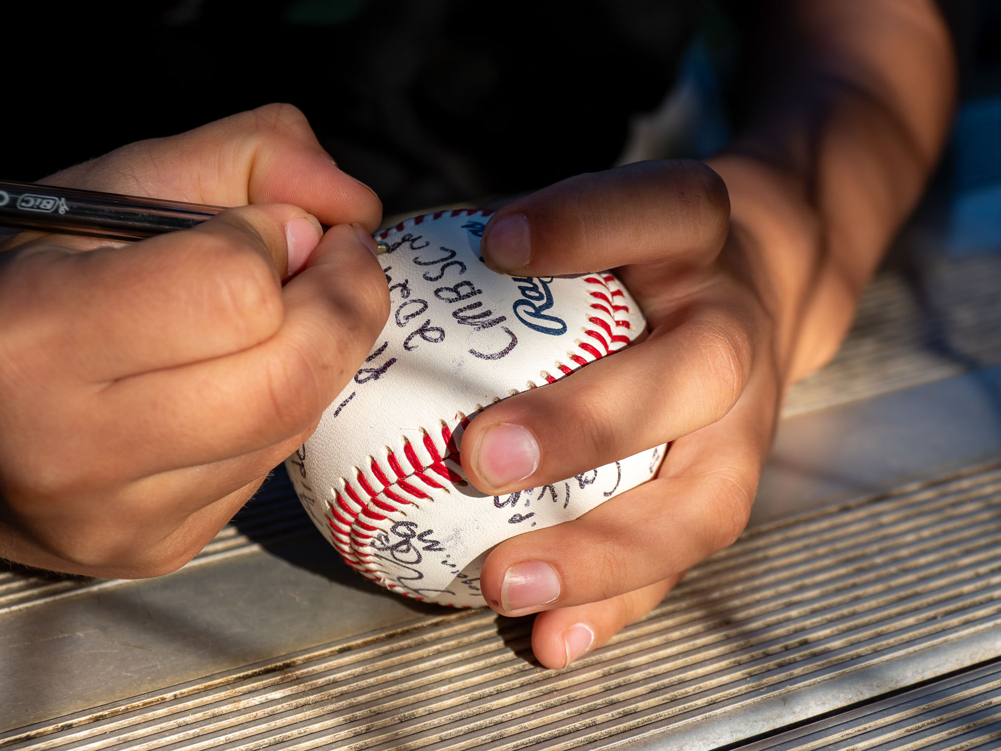 Players signing the game ball