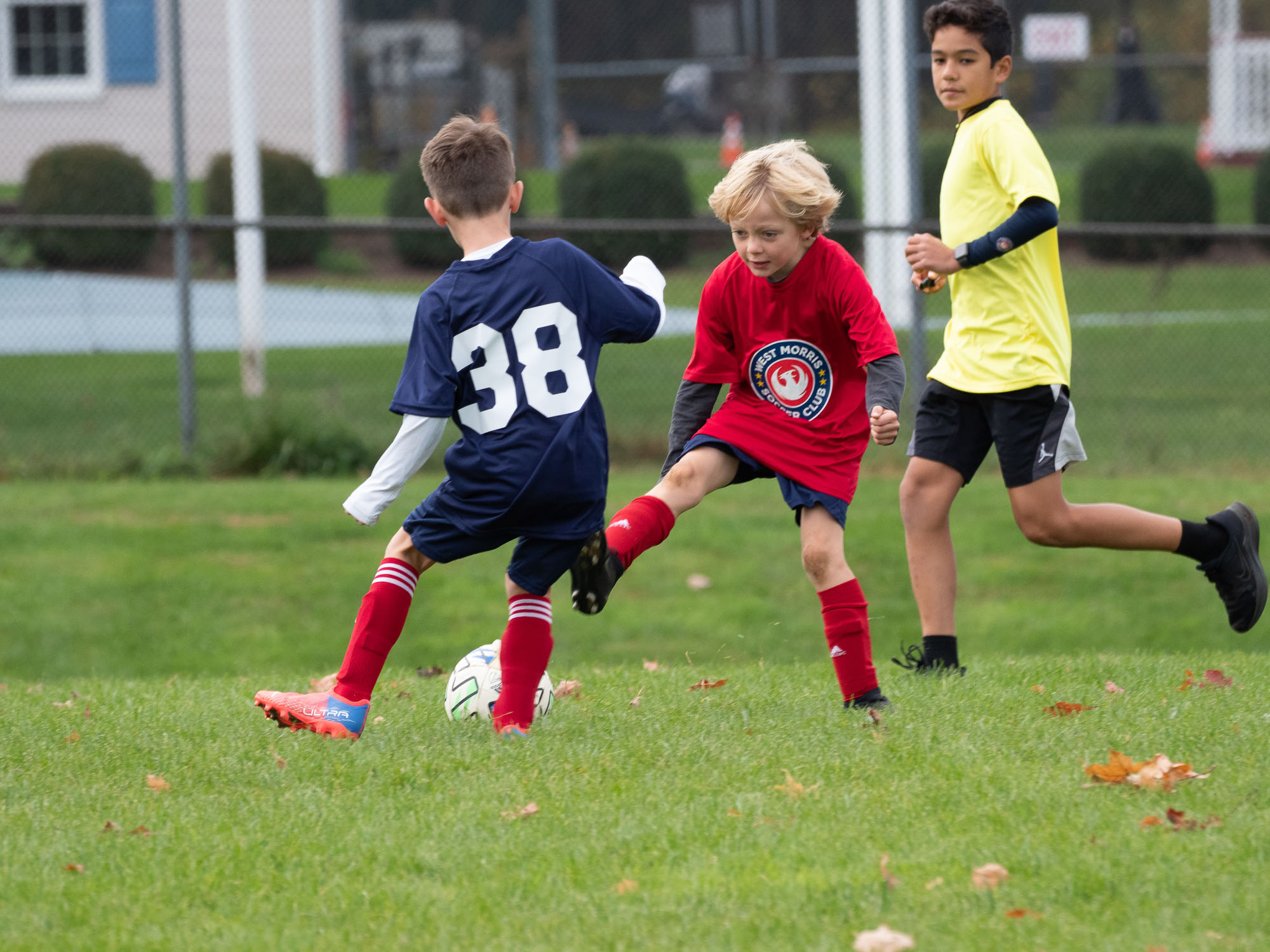 West Morris soccer — three players battle for the ball